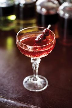 a close up of a wine glass on a table