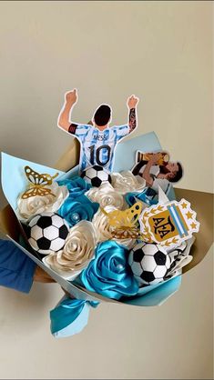 a bouquet of cupcakes in the shape of soccer players