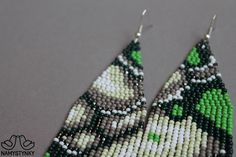 These abstract green beaded earrings are made of high-quality Czech beads and strong synthetic thread. They are elegant, fashionable, and highly versatile, suitable for everyday wear. Features: Sterling silver components Color: Black, gray, white, green, silver. This item is currently in stock. More beaded earrings http://etsy.me/2ycItdb Gerdan necklaces http://etsy.me/2mihf0J Beaded necklaces http://etsy.me/2Dkf1Fo Crochet necklaces http://etsy.me/2CAPdFc Back to shop https://www.etsy.com/shop/ Green Bohemian Beaded Earrings With Tiny Beads, Green Bohemian Chandelier Earrings With Colorful Beads, Bohemian Green Chandelier Earrings With Colorful Beads, Bohemian Green Beaded Earrings With Colorful Beads, Green Bohemian Beaded Earrings, Bohemian Green Beaded Earrings, Elegant Green Chandelier Earrings With Colorful Beads, Elegant Green Beaded Chandelier Earrings, Green Bohemian Beaded Drop Earrings