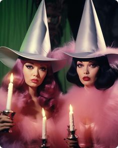 two women wearing hats with candles in their hands