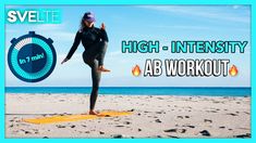 a woman standing on top of a yellow mat in front of the ocean with words high intensity ab workout