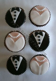 six decorated cupcakes in the shape of heart and tuxedo with pearls