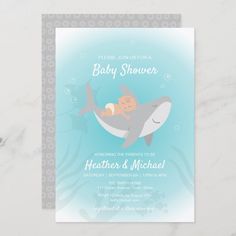 a baby shower is shown with an image of a shark and its child on it