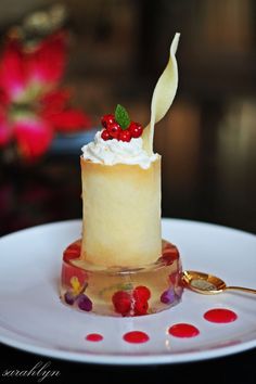 a small cake sitting on top of a white plate