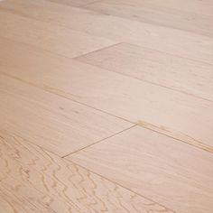 a dog laying on top of a wooden floor