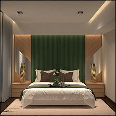 a large bed sitting in a bedroom next to a green wall