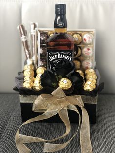 a bottle of jack daniels and some chocolates