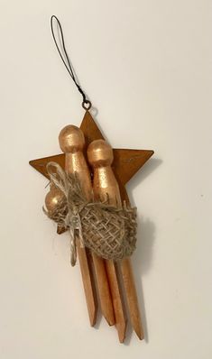 an ornament made out of wood sticks and twine