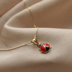 Ladybug Necklace 14K Real Gold Pendant Charm Dainty Luck Chain Black-Red Enamel Summer Design Gift For Women Minimalist Design Animal Figure Nearly all cultures believe that a ladybug is lucky. Many societies also link the sight of a ladybug with future luck in love, good weather or the granting of wishes. Having a ladybug land on you is supposed to be particularly lucky in some cultures. Ladybug is the perfect gift for special occasions to your loved ones. ⓂMaterials & Specifications : Neck Elegant Enamel Tarnish Resistant Jewelry, Elegant Enamel Jewelry With Tarnish Resistance, Tarnish Resistant Enamel Jewelry Gift, 14k Gold Jewelry With Black Enamel, Classic Black Enamel Necklaces For Gifts, Dainty Red Charm Necklace For Everyday, Yellow Gold Necklaces With Black Enamel For Gift, Elegant Enamel Jewelry With Delicate Chain, 14k Gold Necklace With Black Enamel For Gift