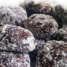 powdered chocolate donuts piled on top of each other