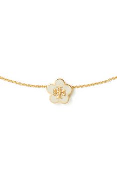 A flower-shaped logo medallion brings a pretty focal point for this delicate goldtone necklace. 16" length; 2" extender; 3/8" diameter pendant Goldtone plate/enamel Imported Evry Jewels Necklaces Stack, Cool Gold Necklaces, Enewton Necklace, Christmas List Items, Trendy Things, Tory Burch Necklace, Evry Jewels, Cute Necklaces, Tory Burch Earrings