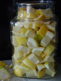 a glass jar filled with sliced up fruit