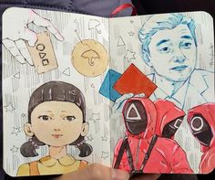 a person holding a book with drawings on it and an image of two people in the background