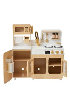 a toy kitchen with wooden furniture and accessories