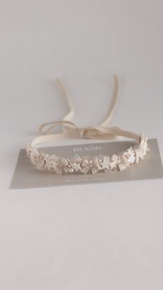 a white headband with flowers on it