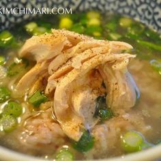 a close up of a bowl of food with broccoli and meat in it