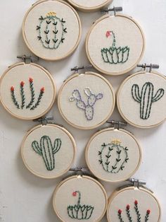 six embroidery hoops with embroidered cactus designs on them