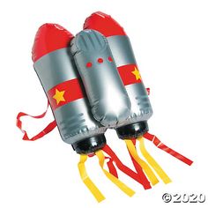 two inflatable boxing gloves are tied to red and yellow ribbons on white background