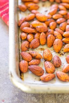 almonds on a baking sheet ready to be baked in the oven for roasting