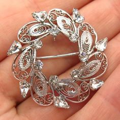 925 Sterling Silver Vintage Carl Art Rhinestone Filigree Leaf Design Pin BroochWeight: 5.8gWELCOME TO PAWN SHOPWe are an actual pawn shop and have been in business for over 25 years.Since 1990, our establishment has been serving a variety of clients by providing them with short term cash solutions and options of liquidity regarding their treasured heirlooms.Acknowledging that today′s customers are very sophisticated and are looking for a variety of investments, our acquisitions are hand-picked f Silver Crystal Brooches As Gift, Silver Crystal Brooches For Gift, Silver Rhinestone Brooches For Anniversary, Silver Crystal Brooches For Anniversary, Silver Rhinestone Brooches As Gifts, Silver Crystal Brooch For Anniversary, Silver Rhinestone Brooches For Gifts, Silver Crystal Anniversary Brooches, Vintage Brooches With Sparkling Stones As Gift