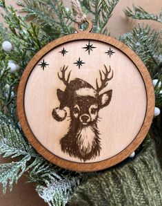 a wooden ornament with a deer's head on it and stars in the background