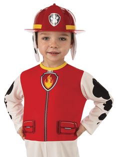 a little boy wearing a fireman's costume with a helmet on his head