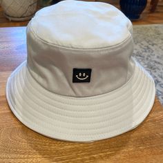 New Cotton Packable Bucket Hat. Cute Smiley Face And Adjustable With Drawstring. Never Worn. Cheap Solid Casual Bucket Hat, Casual Solid Color Cheap Bucket Hat, Cheap Cute Mini Baseball Caps, Cheap Solid Color Bucket Hat, Cute Smiley Face, Cotton Bucket Hat, Smiley Face, Smiley, Bucket Hat