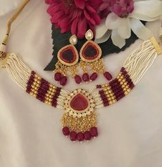 A symbol of feminism and elegance. Prepare yourself for the festive season with this gorgeous Choker set with Earrings. Traditional Beaded Party Sets, Traditional Beaded Sets For Festive Season, Traditional Festive Beaded Sets, Festive Traditional Beaded Sets, Festive Beaded Wedding Set, Beaded Jewelry Sets For Festivals And Celebrations, Traditional Beaded Wedding Sets, Red Beaded Kundan Necklace For Wedding, Festive Beaded Jewelry Sets