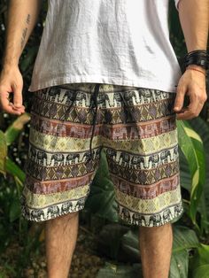 "Our Cotton woven shorts now come in unique variants,beautifully in vibrant colors, All with elastic waist band and 3 pockets - Elastic waistbands. - Jacquard Cotton Fabric. SIZE: MEASUREMENTS OF SHORTS Approx.: Waist: 27\" Stretches up to 36\" Hips: 42 inches **19\" full length (49cm) * front rise 13\" , inseam 7\" **leg opening, 12\" Please Bear in Mind That Photo May Slightly Different From Actual Item in Terms of Color Due to the Lighting During Photo Shooting or the Monitor's Display. CARE Bohemian Bottoms For Summer Music Festival, Casual Multicolor Shorts For Festival, Hippie Style Beach Bottoms For Festivals, Multicolor Hippie Shorts For Vacation, Casual Boho Print Bottoms For Beach, Casual Cotton Shorts For Festival, Multicolor Shorts With Pockets For Festivals, Traditional Beach Bottoms With Pockets, Casual Beach Bottoms For Festivals