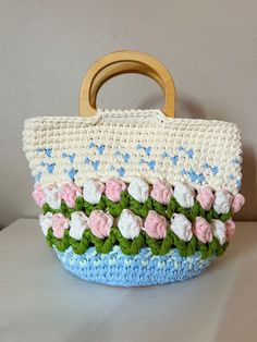 Get a 25% discount and free shipping on orders over $35 for a hand-crocheted tulip-patterned tote bag, which can be hand-washed and air-dried. Spring Cotton Crochet Bag, Elegant Spring Crochet Tote Bag, Tulip Bag Pattern, Crochet Tulip Bag Pattern Free, Tulip Tote Bag Crochet, Tote Bag Pattern, Hand Crochet, Mother Gifts, Tulips