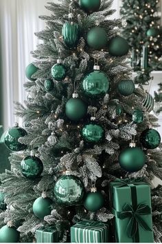 a christmas tree with green and silver ornaments