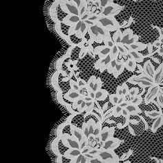 white lace with flowers on black background