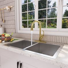 a kitchen sink sitting under a window next to a counter top with fruit on it