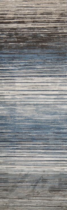 an area rug with blue, grey and white stripes