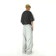 Elevate your wardrobe with our items, the epitome of modern elegance and versatility of Korean Men’s Fashion. Gray Relaxed Fit Bottoms, White Full-length Parachute Pants For Streetwear, Baggy Gray Full-length Pants, Oversized Sporty Trousers, White Full Length Parachute Pants For Streetwear, Gray Relaxed Fit Long Pants, Gray Baggy Full-length Pants, White Baggy Full-length Parachute Pants, Gray Pants With Loosely Fitted Hips