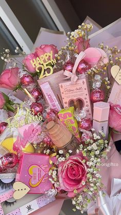 a bouquet of pink flowers and personal items for a woman's 30th birthday party