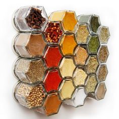 an assortment of spices arranged in hexagonal containers