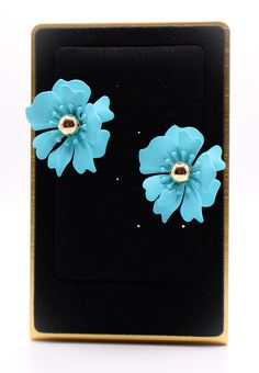 Make your fashion statement with these unique blue flower earrings. Crafted with precision and attention to detail, these earrings are sure to bring out your unique style and make you stand out from the crowd. An ideal accessory for any ensemble, these earrings will be sure to upgrade your fashion outlook. Care: To restore the luster and shine of your jewelry, use a jewelry cloth or soft cotton cloth to gently buff the piece. Size and Fit: 1.8 inches Trendy Blue Jewelry For Spring, Trendy Blue Earrings For Spring, Blue Spring Earrings For Pierced Ears, Blue Flower Earrings For Spring Parties, Blue Drop Flower Earrings For Party, Trendy Turquoise Party Earrings, Blue Flower Earrings For Party, Blue Flower Earrings For Spring, Turquoise Earrings For Spring Party