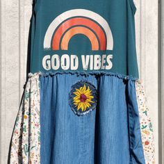 a dress with sunflowers and good vibes on it