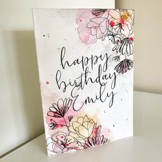 a birthday card with watercolor flowers on it