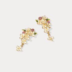 Adorn your ears with these elegant and timeless Osmanthus Fragrans earrings. Crafted with masterful skill and intricate enamel detailing, every unique pair of earrings tells a story of resplendent beauty and refined luxury. DETAILS Plating: 18K Gold Materials: 18K Gold on Brass, Enamel, Silver Size:  1.26"*0.71"(32mm*18mm) Weight:  2.9 g/pr Hypoallergenic design Elegant Enamel Drop Flower Earrings, Elegant Enamel Flower Earrings For Wedding, Gold Enamel Flower Earrings, Gold Enamel Flower Earrings For Wedding, Gold Meenakari Enamel Earrings, Osmanthus Fragrans, Poppy Necklace, Oranges Gift, Luxury Details