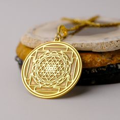 14K Gold Handmade Sri Yantra Necklace - Spiritual Gold Necklace, Sri Yantra Charm Necklace, It can be considered a spiritual gift. Pendant Details 💎 Gold KT: 14K Solid Gold or 8K Solid Gold 💎Gold Color Options: Yellow Gold, White Gold, Rose Gold 💎Thickness: 0.80 mm ✈️ Ready to Ship in 4-7 Business Days ✈️ Transportation is provided by express cargo MORE OF US Pendants and Necklaces: https://goldencastlejewelry.etsy.com NECESSARY INFORMATION 🧡 We provide workshop service in Ankara, we are hap Symbolic Jewelry For Navratri Rituals, Symbolic Jewelry For Navratri Puja, Symbolic Jewelry For Puja And Navratri, Spiritual Locket Necklace For Navratri, Spiritual Necklaces For Navratri, Spiritual Round Pendant Necklaces For Rituals, Handmade Spiritual Necklace For Navratri, Spiritual Round Necklaces For Festivals, Round Amulet Necklaces For Puja