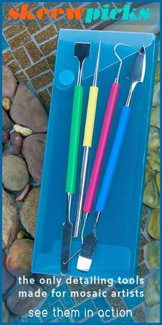 three different colored toothbrushes sitting in a box on some rocks and gravel with the words, between them there are only dental tools made for mosaic artists see them in action