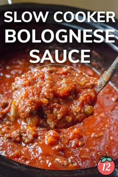 slow cooker bolognesee sauce in a crock pot with a spoon