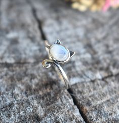 Cat Ring Details:-Choice of Natural Rainbow Moonstone, Dominican Larimar, or Natural Amethyst- 12mm face height- 2mm smooth round band- .925 solid sterling silver- Available in US ring sizes 4-10.5 with 1/2 sizes. 💜Connect with us on Instagram @a_wild_violet for sales and giveaways!**All items are in stock and ship within 2-5 business days from received payment (excluding Saturday/Sunday) from the US. If you are within the US please expect 3-7 business days for shipping transit and delivery. In Adjustable Moonstone Jewelry With Round Stone, Adjustable Moonstone Ring As Birthstone, Adjustable Round Moonstone Jewelry, Adjustable Moonstone Ring With Round Stone, Adjustable Fit Moonstone Ring With Round Stone, Mystical Round Cabochon Jewelry, Spiritual Nickel-free Moonstone Ring, Nickel Free Round Spiritual Moonstone Ring, Nickel-free Spiritual Round Moonstone Ring