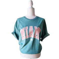 📦 FREE SHIPPING on orders $35 or more to US shoppers 🛒Our unisex Miami Florida Palm Tree T-Shirts are a soft relaxed/loose fitting t-shirt perfect for summer and lounging at the beach or around the house. 👕Brand = Comfort Colors 🧵Fabric = 100% Cotton ✂️Design = Heat-applied vinyl (Blush Pink & White) 🎨Color = Seafoam Green (Colors will vary from computer to computer and monitor to monitor. The colors shown may not be an exact representation. Slight shade variations of garment colors are Florida Tshirt, Florida Palm Trees, Miami Shirt, Seafoam Green Color, Summer Island, Preppy Shirt, Trendy Clothes, Comfort Color, Island Beach