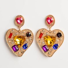 The 80's are back with the Burnout Earrings by Petite Moments! Colorful cubic zirconia stones are set in yellow gold plated heart earrings for the perfect bold, statement earrings. Shop more fun and bold earrings at Local Eclectic. Trendy Gold Jeweled Crystal Earrings, Trendy Gold Heart Earrings For Party, Glamorous Gold Heart Earrings, Gold Cubic Zirconia Heart Earrings For Party, Yellow Gold Plated Party Earrings, Gold Heart Shaped Crystal Earrings For Party, Adornment Jewelry, Bold Statement Jewelry, Local Eclectic