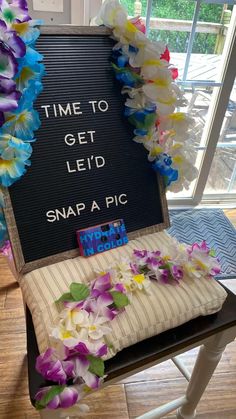 a sign that says time to get leid snap a pic with flowers on it