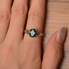 It is lab emerald ring. The main stone is 7mm*9 mm oval cut.weight about 1.58 carats. The basic metal is sterling silver and plated with rhodium. To change the metal to a solid gold (white/rose) or platinum is also available, please ask for a quotation if you want. You can also go to my shop Home for more elegant rings: https://www.etsy.com/shop/godjewelry?ref=hdr_shop_menu Emerald is May birthstone More emerald rings: https://www.etsy.com/shop/godjewelry?section_id=20709240 Customization is alw Dainty Oval Emerald Ring With Prong Setting, Green Oval Rings For Promise, Green Oval Sterling Silver Birthstone Ring, Oval Emerald Promise Ring, Silver Oval Emerald Ring With Prong Setting, Oval Solitaire May Birthstone Ring, Oval Solitaire Emerald Ring For May Birthstone, Oval Opal Ring For May Birthstone, Oval Emerald May Birthstone Ring