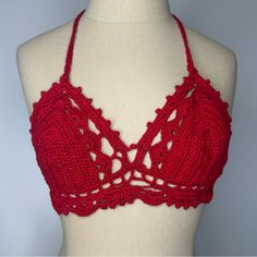 a crocheted bralet is shown on a mannequin's torso